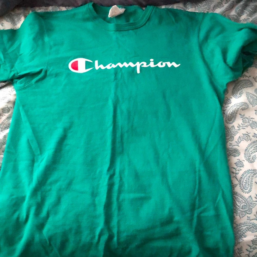 A green Champion shirt